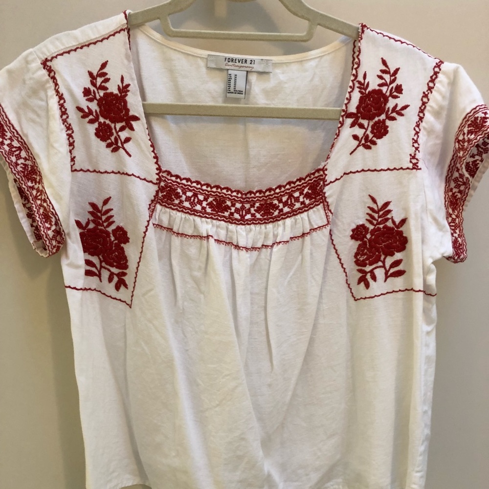 White shirt with red embroidery detailing